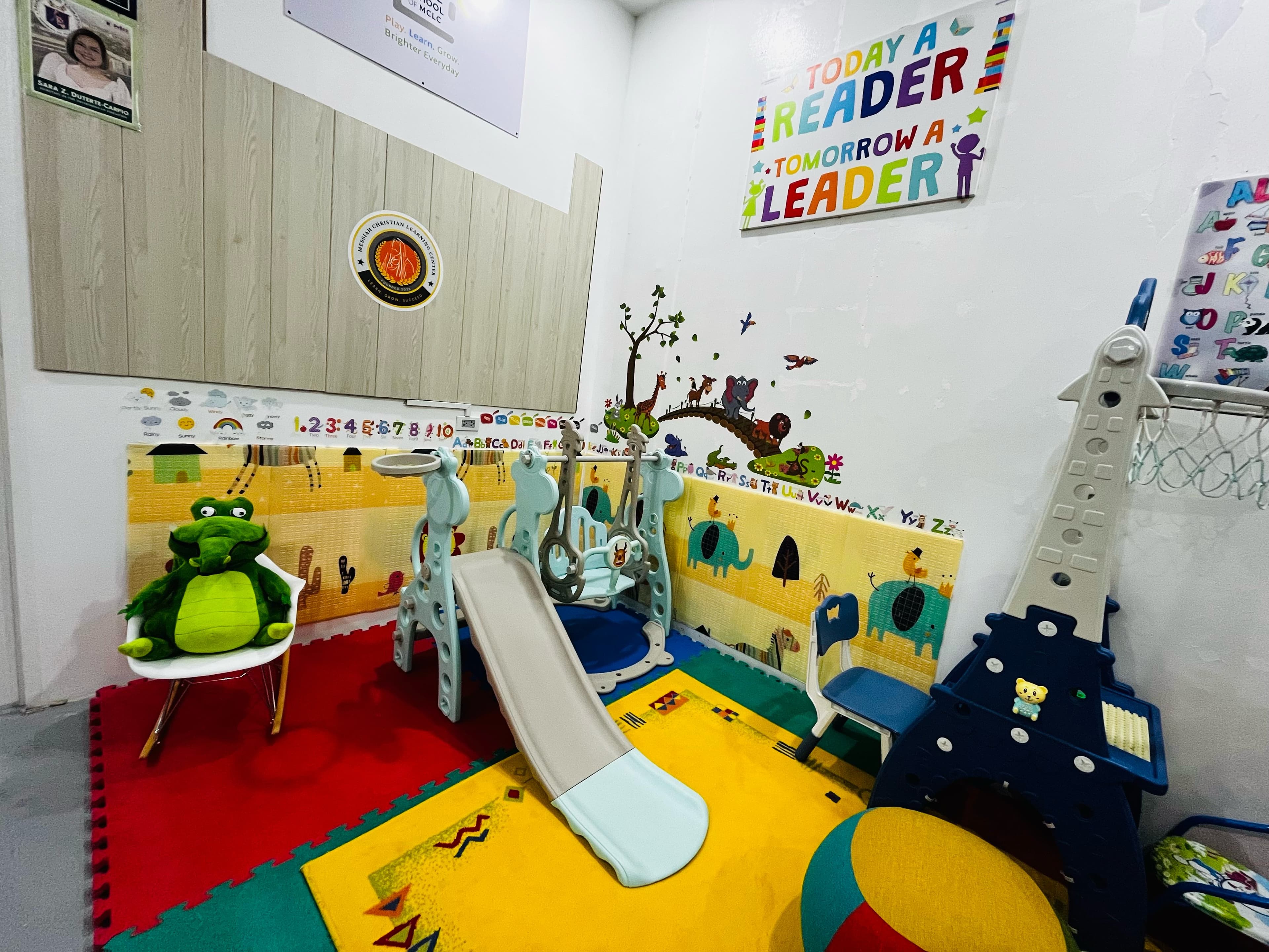 Toy shelves stocked with learning materials at MCLC